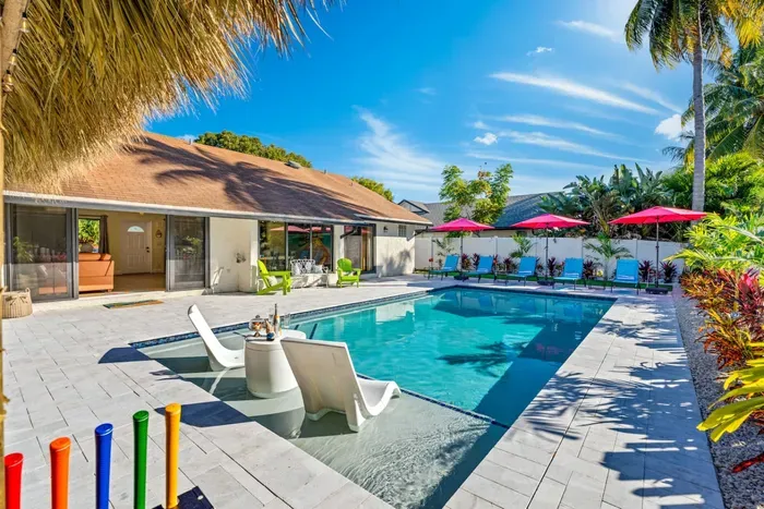 The in-pool lounges are the heart of the backyard.