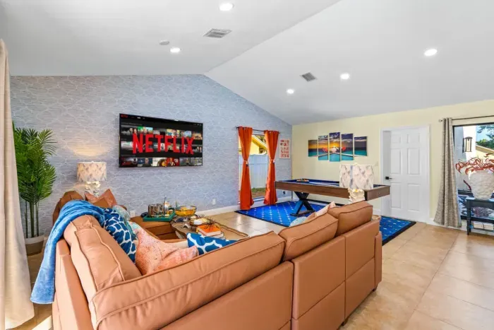 Stretch out on the comfy sectional sofa and enjoy the 75" smart TV after a fun-filled day at Delray Beach, the perfect spot for family movie nights and game-day streaming.