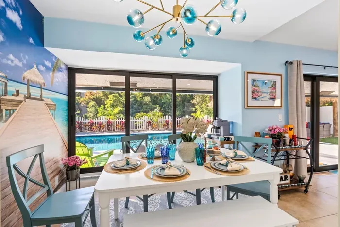Gather around the dining table for six and enjoy a relaxed family meal while the open patio doors let in fresh air and Florida sunshine.