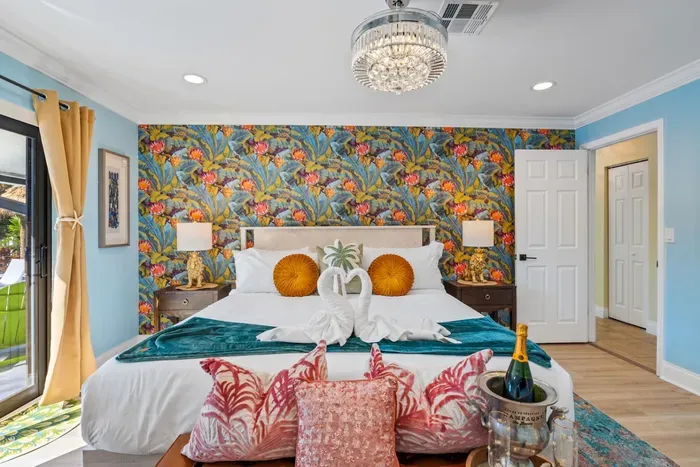 Drift off in the primary bedroom's king-size bed with premium linens and a 55" Roku smart TV, creating a private retreat after a day on the water.