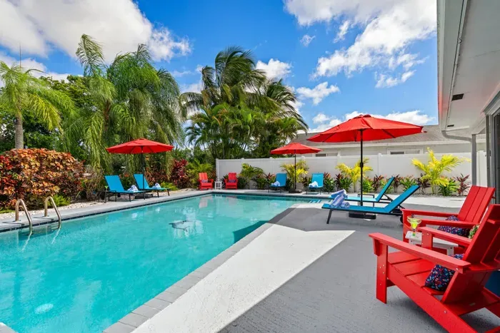 With a heated pool, tiki hut bar, canal frontage, and multiple seating areas, this outdoor space is made for long, lazy days and unforgettable nights in Boynton Beach.