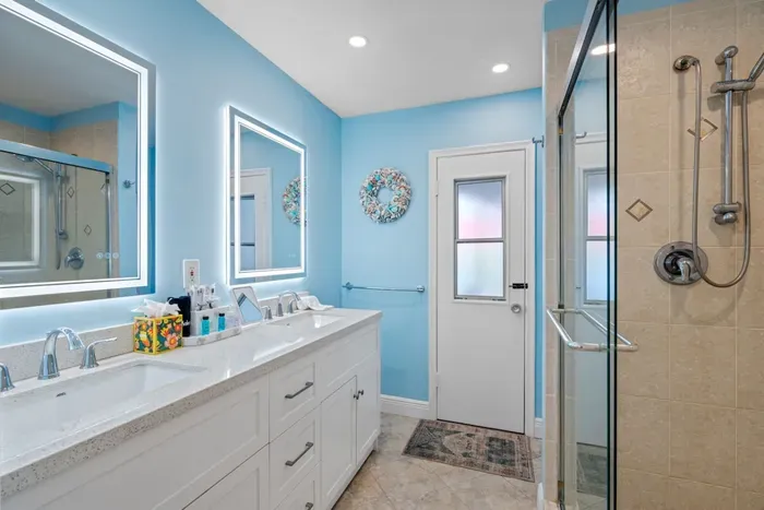 Clean, bright, and thoughtfully designed, the bathrooms complement the home's modern style and resort-like feel.