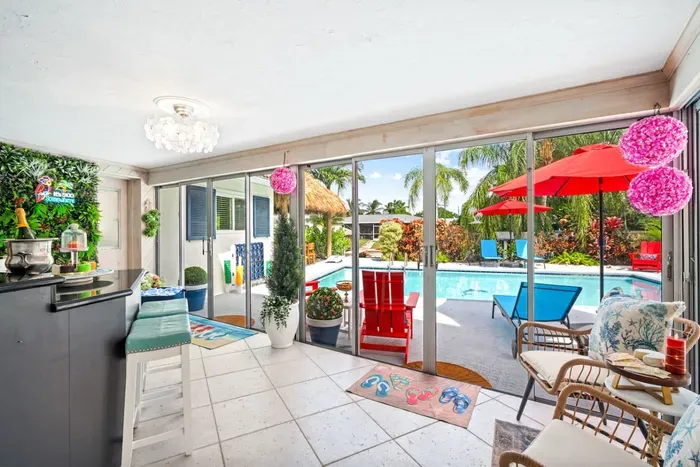 Floor-to-ceiling backyard doors let in plenty of natural light and let you marvel at the yard's views.