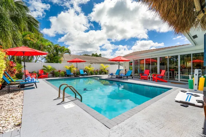 Comfortable loungers and small tables around the pool make it easy to settle in with a book, a snack, or a cold drink between dips.