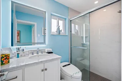 Start your day in a fresh, modern bathroom with a walk-in shower, plush towels, and essential toiletries provided so you can pack lighter.