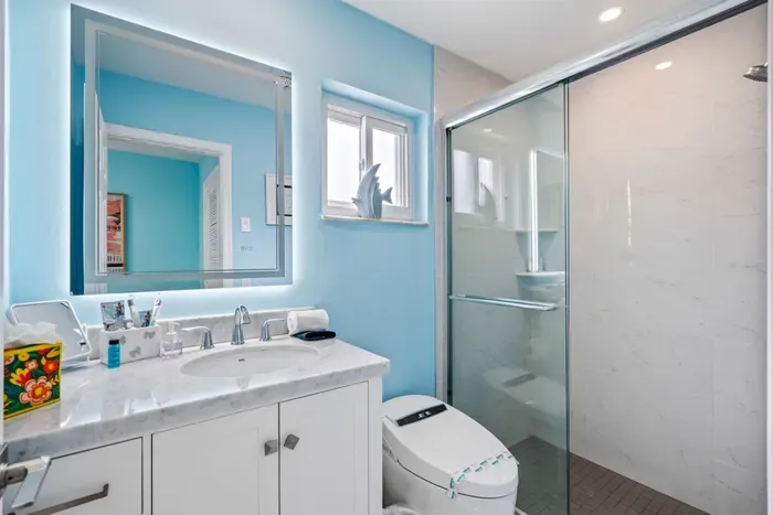 Start your day in a fresh, modern bathroom with a walk-in shower, plush towels, and essential toiletries provided so you can pack lighter.