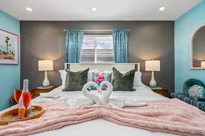 Retreat to the master bedroom with a king-size bed, premium mattress, and ensuite bathroom, giving you a private sanctuary to unwind after a busy day exploring South Florida.