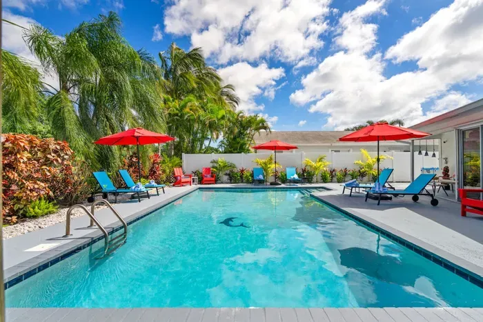 The fully fenced backyard offers peace, privacy, and plenty of room for kids and pets to play while adults unwind by the heated pool.