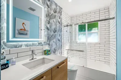 The second bathroom comes with a convenient combo of a tub and a shower.