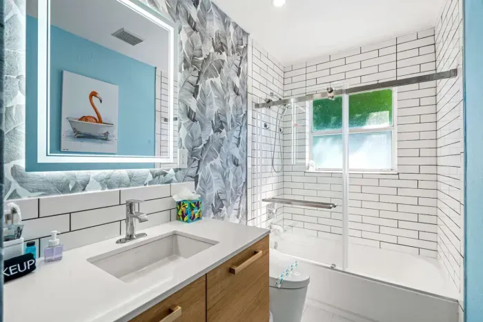 The second bathroom comes with a convenient combo of a tub and a shower.