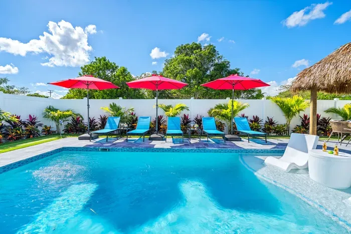 Dive into the heated swimming pool for a refreshing escape, perfect for cooling off on warm Florida days.