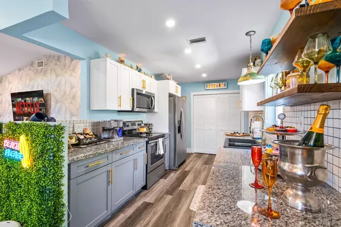 The kitchen is designed for both convenience and style, blending functionality with modern aesthetics.