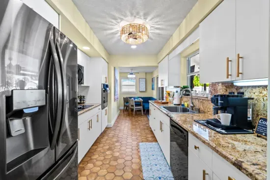 Cook up a storm in the fully equipped kitchen with sleek appliances, plenty of workspace, and everything needed for delicious homemade meals.