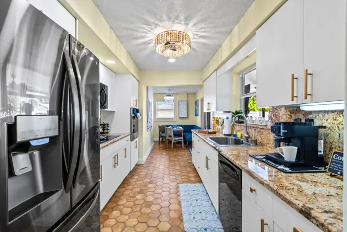 Cook up a storm in the fully equipped kitchen with sleek appliances, plenty of workspace, and everything needed for delicious homemade meals.