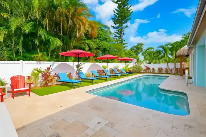 Dive into the heated swimming pool for a refreshing escape, perfect for cooling off on warm Florida days.