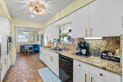 Sip your morning coffee with the coffee maker and a view of the backyard, starting your day in comfort.