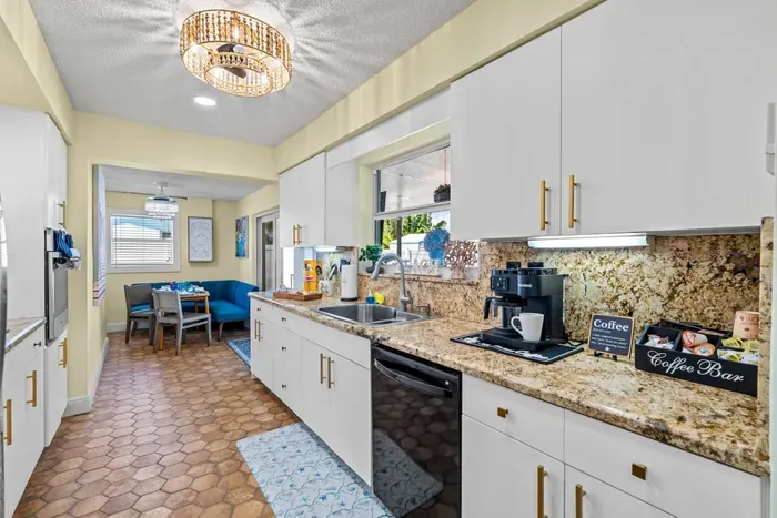 Sip your morning coffee with the coffee maker and a view of the backyard, starting your day in comfort.