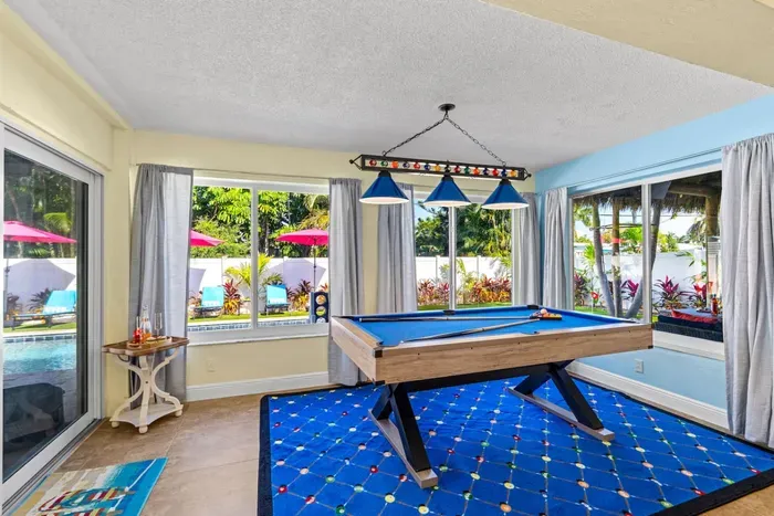 Open the game area doors and immerse yourself in the luxurious indoor/outdoor living experience.