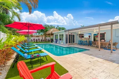 Finally, we arrive at the tropical outdoors! Cool off in the pool, work on your vacation tan on the comfy lounges, enjoy tasty BBQ and drinks at the tiki hut, or play various games, including mini golf, in this stunning backyard oasis!