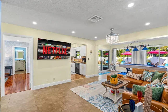 Enjoy movie nights with a 65" HDTV and Roku, offering endless entertainment options for all ages.