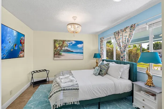 Rest easy in a king-size bed with premium linens and blackout curtains, ensuring a peaceful night's sleep.