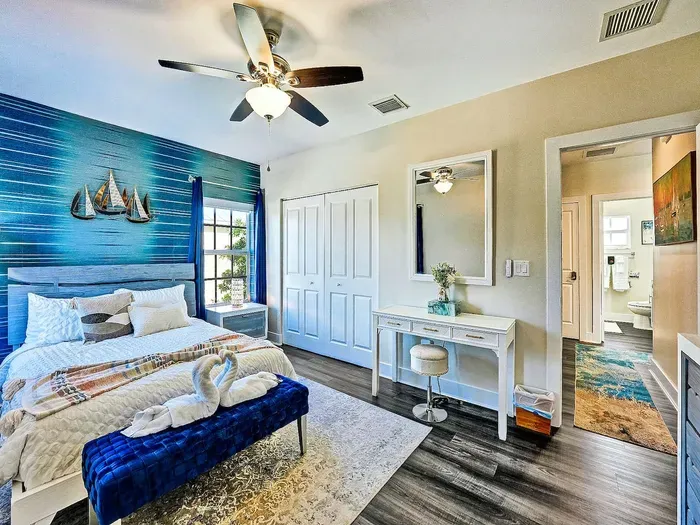 This room also has a walk in closet with lots of room for your clothing.  Make use of the dedicated workspace area too with the small desk for whoever needs to catch up on some work or finish off a project.