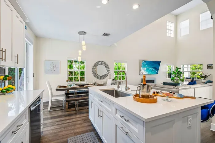 The open concept proudly leads to the dining table where you can serve up your kitchen creations and enjoy your meals before continuing the fun of the evening!