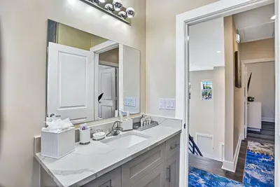 The toilet is also a bidet, whilst the vanity area provides lots of room for everyone's lotions and potions.