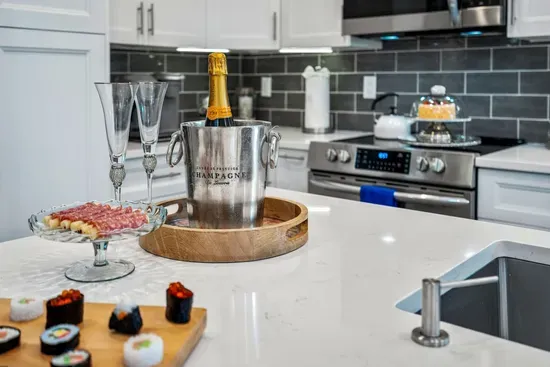 Have a few drinks at the kitchen bar while watching the designated chef in action.