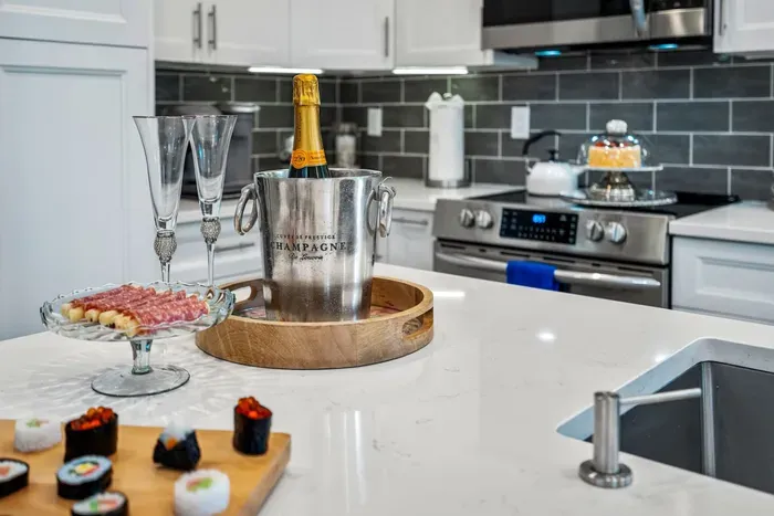 Have a few drinks at the kitchen bar while watching the designated chef in action.