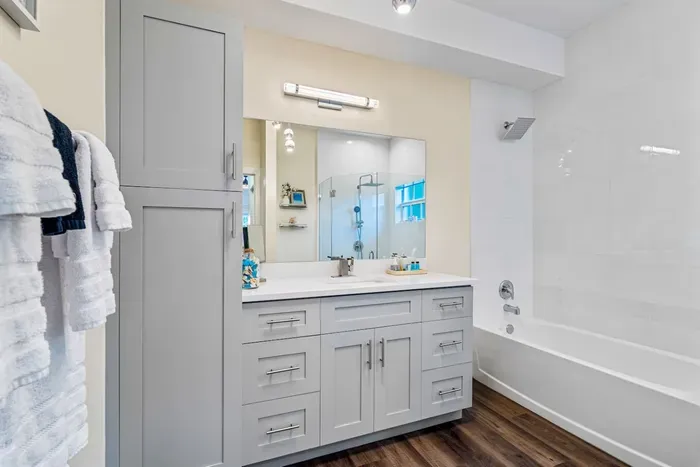 Welcome on into the Primary bedroom ensuite with a charming design to it, make use of the huge vanity area with a large mirror, perfect for getting ready in front of after your refreshing bath or shower! The choice is yours.