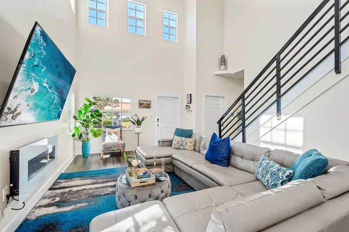 Moving on into the grand 2 story family room, with a huge 75” HDTV with Roku sat patiently waiting above the electric fireplace in front of the large comfortable sofa - put on your favorite movies and get ready for an exciting night!