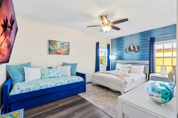 Moving on into the 2nd bedroom, this large and spacious room is fitted with a queen sized bed, a day bed with trundle bed, and 65” HDTV with Roku allowing you to have your own private entertainment before drifting off to sleep.