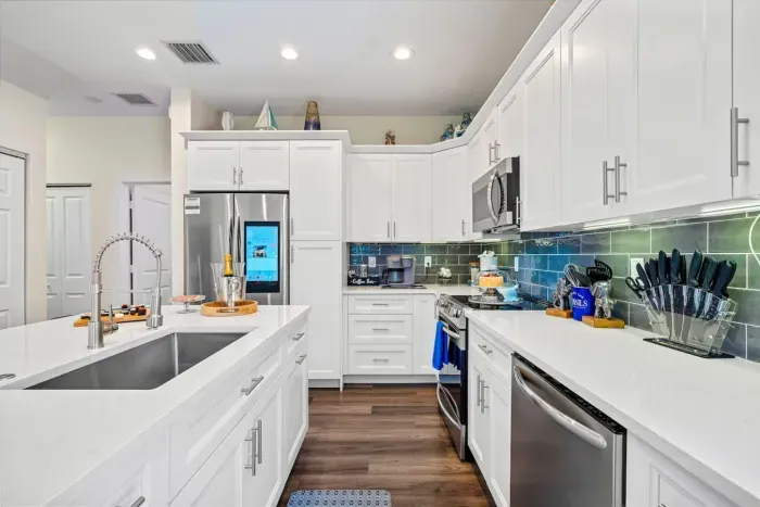 The open concept proudly leads to the dining table where you can serve up your kitchen creations and enjoy your meals before continuing the fun of the evening!