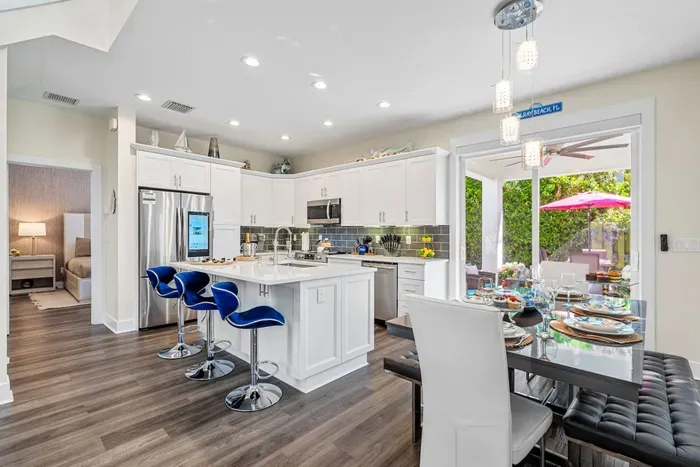 Make your way to the outdoor oasis through glass sliding doors just at the end of the dining table.