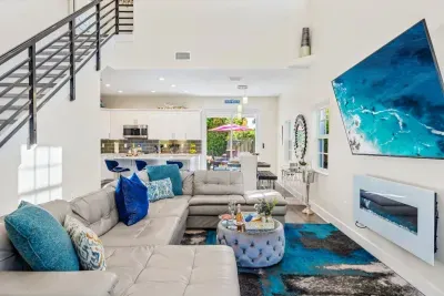 The super high ceilings within the family room really gives a spacious and airy feel whilst the electric fireplace gives off an ambient and cozy affect when chilling out on the huge sofa.