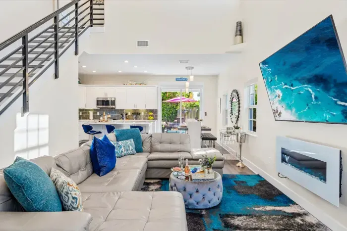 The super high ceilings within the family room really gives a spacious and airy feel whilst the electric fireplace gives off an ambient and cozy affect when chilling out on the huge sofa.