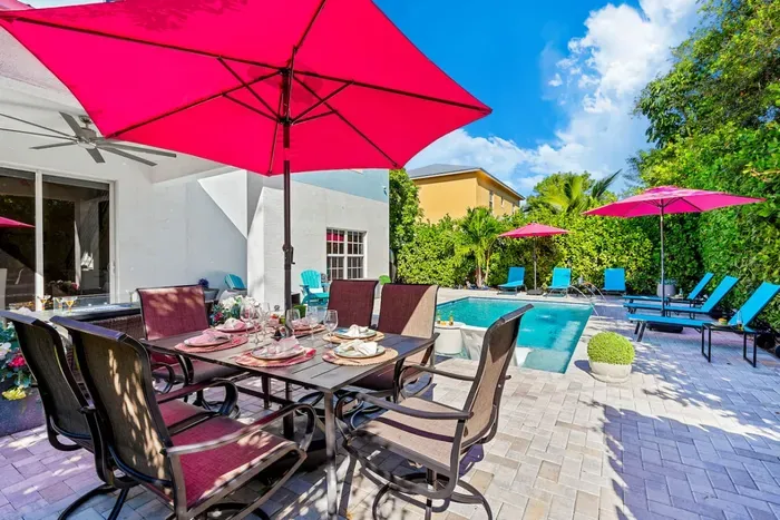 Enjoy outdoor dining on this table with seating for 6 and for those that need shade the firepit table is the place to be or perhaps under the multiple umbrellas.