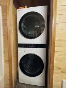 Modern LG washer/dryer in cozy nook—ideal for longer stays.