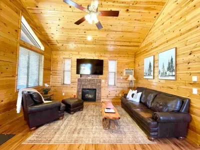 The spacious living room with propane fireplace is the perfect spot to relax.