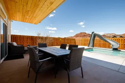 Covered patio with outdoor furniture so everyone can enjoy the outdoors and the red cliffs.