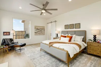 Wind down in the king-sized bed in the primary bedroom. 