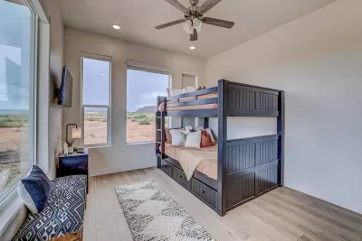 The third bedroom features a queen over queen bunk bed with a trundle that slides out, making three queen-sized beds!