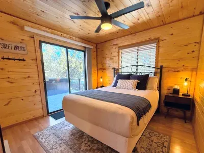Comfortable queen-size bed in the bedroom. Back door to the deck and private hot tub.