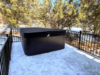 The private hot tub is on the back deck. A great spot to relax and star gaze.