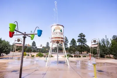 Family-friendly splash pad with tipping buckets at Rocky Rim