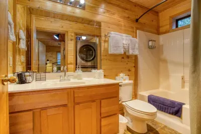 The bathroom has a shower/tub combo and a decent sized vanity.