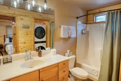 The bathroom has a shower/tub combo and a decent sized vanity.