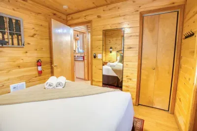 The primary bedroom has a full-length mirror and extra towel hooks.