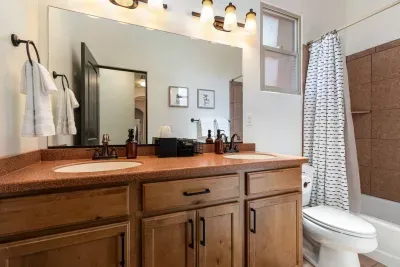 The second bathroom has double sinks and a shower/tub combo. 